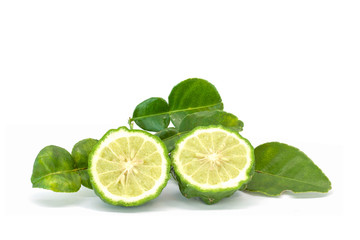 Cut half bergamot, Kaffir lime, Leech lime or Mauritius papeda with leaf is a vegetable and herb of Thailand used as an ingredient in cooking and herbal medicine isolated on white background.