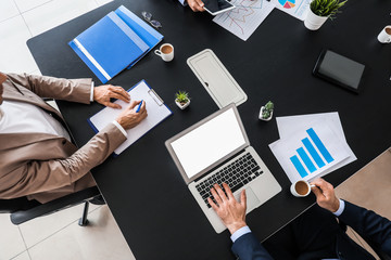Group of business people during meeting in office, top view