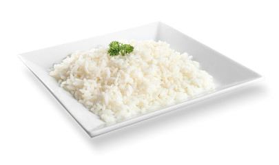 Plate with boiled rice on white background