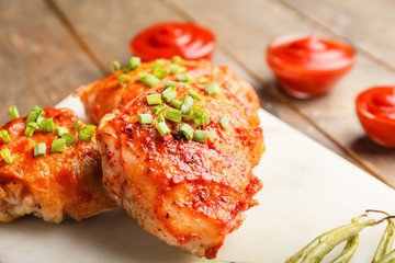 Cooked chicken thighs on table, closeup