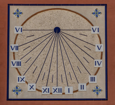 Medieval sun dial on the side of an old house in Onda Spain