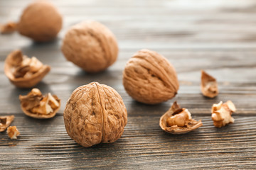 Tasty walnuts on wooden table