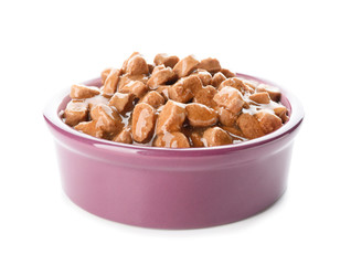 Bowl with pet food on white background