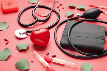 First aid kit on color background