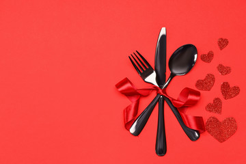 Beautiful table setting for Valentine's Day on red background