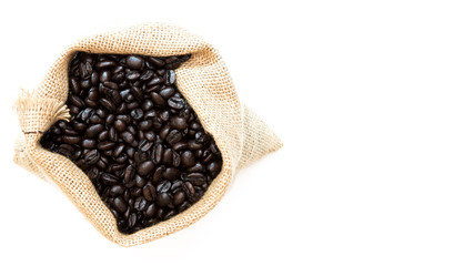 Roasted Coffee Beans in Jute Bag on white background with Copy Space