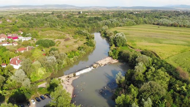 Drone Aerial Romania countryside river trees swamp green field drone