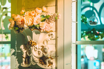 Many artificial pink and white roses are decorated on the wall to the backdrop in the wedding day. Beautiful flowers background, Selective focus.