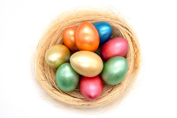 color easter eggs in basket isolated on white