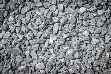 Gravel gray small rock and stone texture background.