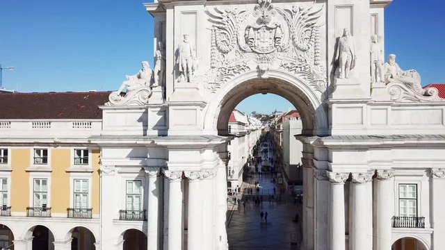 Slow aerial push to Rua Augusta Arch in Pra&ccedil;a do Com&eacute;rcio in Lisbon Portugal