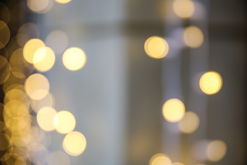 blurred golden circles of lights. defocused lights of festive garland