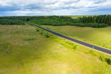 Top view of the road through the agricultural field