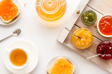 Tea party with jam. Toast, teapot, cup on white background