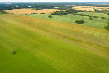 Naklejka premium Aerial view of an agricultural field in an autumn evening
