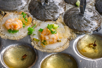 Closeup photo of Vietnamese fried tiny shrimp pancake- Banh Khot