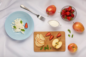 Healthy breakfast or snack. Fruits, cottage cheese. strawberries apples