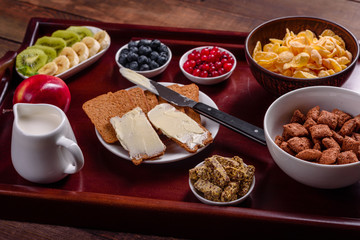 Delicious breakfast with fresh croissants and ripe berries