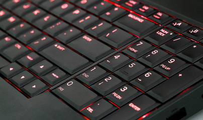 Close up led backlit computer laptop keyboard