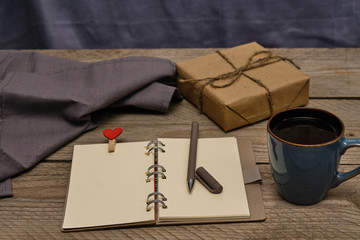                      Top view of workplace. Vintge style. Craft present, cotton napkin, and notebook from recycled paper. Eco Friendly concept