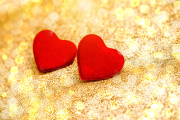 Heart symbol on a gold shiny background