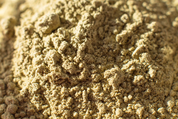natural henna powder, Concept female beauty and cosmetology. Eyebrow and hair coloring. macro shot. fine quality grinding