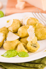 Potato gnocchi stuffed with pesto sauce.
