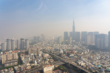 Fototapeta na wymiar Industrial city background with sky hazed with smog 