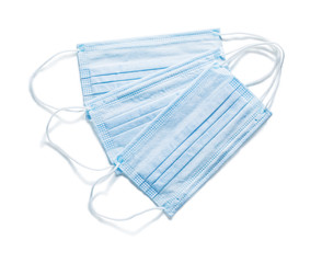 three blue sterile flu masks isolated medical tools