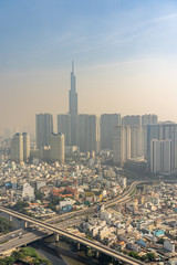 Air polluted industrial city with tall buildings background