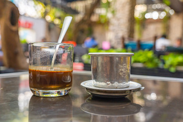 Vietnamese traditional morning drink- fin coffee mixed with milk