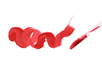 Smear liquid red lipstick and brush isolated on a white background.