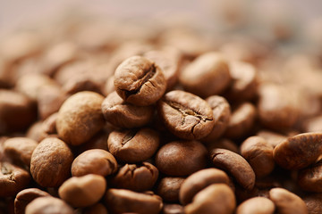 Roasted coffee beans close up. Espresso dark, aroma, black caffeine drink