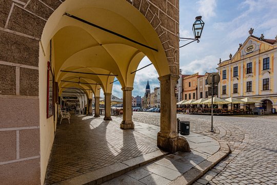 Telc / Czech Republic - September 27 2019: View of a historical city centre, UNESCO world heritage place, with arcades, houses and cobblestone street on a sunny morning.