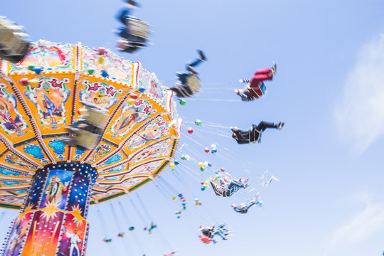 Chain carousel ride in an amusement parks carnivals or funfair, Munich, German