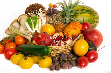 A pile of exotic fruits on a white background