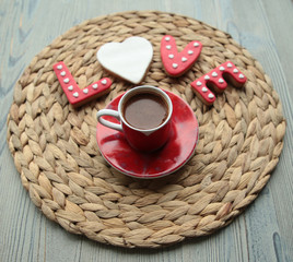 a cup of Turkish coffee and cookies specially prepared for Valentine's Day.