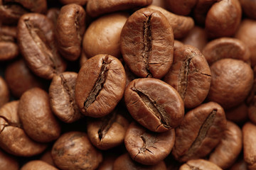 Roasted coffee beans close up. Espresso dark, aroma, black caffeine drink