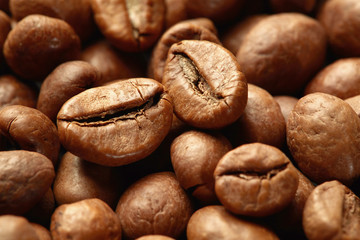 Roasted coffee beans close up. Espresso dark, aroma, black caffeine drink
