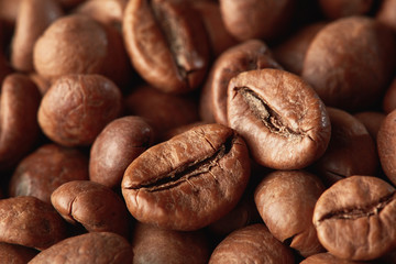 Roasted coffee beans close up. Espresso dark, aroma, black caffeine drink