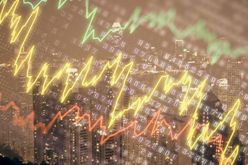 Naklejka premium Double exposure of forex chart drawings over cityscape background. Concept of success.