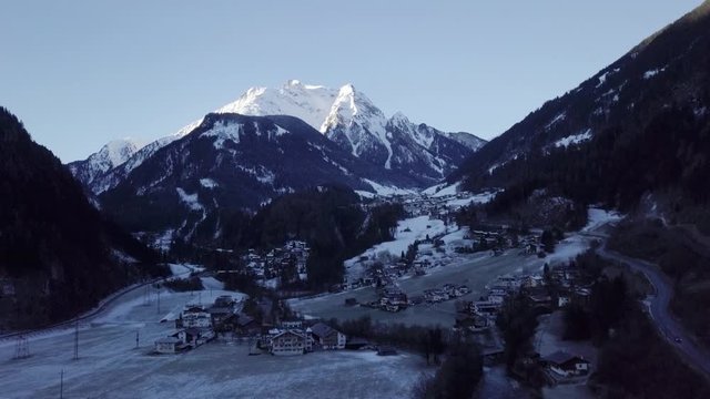 The peaceful Ziller Valley in Tyrol, Austria by the snow white Zillertal Alps - aerial