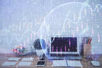 Financial graph colorful drawing and table with computer on background. Double exposure. Concept of international markets.