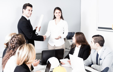 Business handshake at negotiations in office