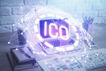 Double exposure of blockchain theme hologram and table with computer background. Concept of bitcoin crypto currency.