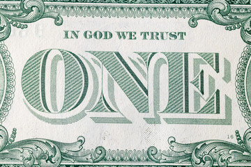 United States one-dollar bill, reverse side with In God We Trust motto.