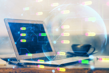Double exposure of desktop computer and technology theme hologram. Concept of software development.