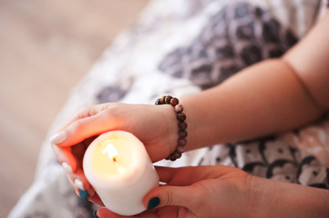 Mysticism in everyday life. Esoteric in a magic candle close-up and copy space. Fortune telling by...