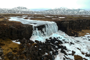 Fototapeta na wymiar Frozen waterfall in Þingvellir National Park