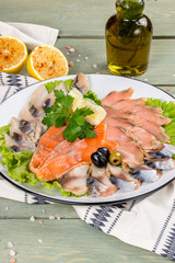 Fish plate with different types of smoked and salted fish